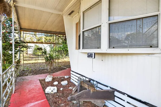 a view of a floor to ceiling window with wooden floor
