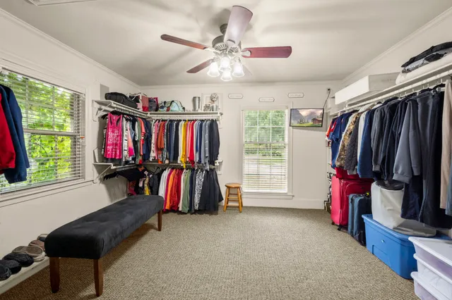 a view of a living room with furniture and a flat screen tv
