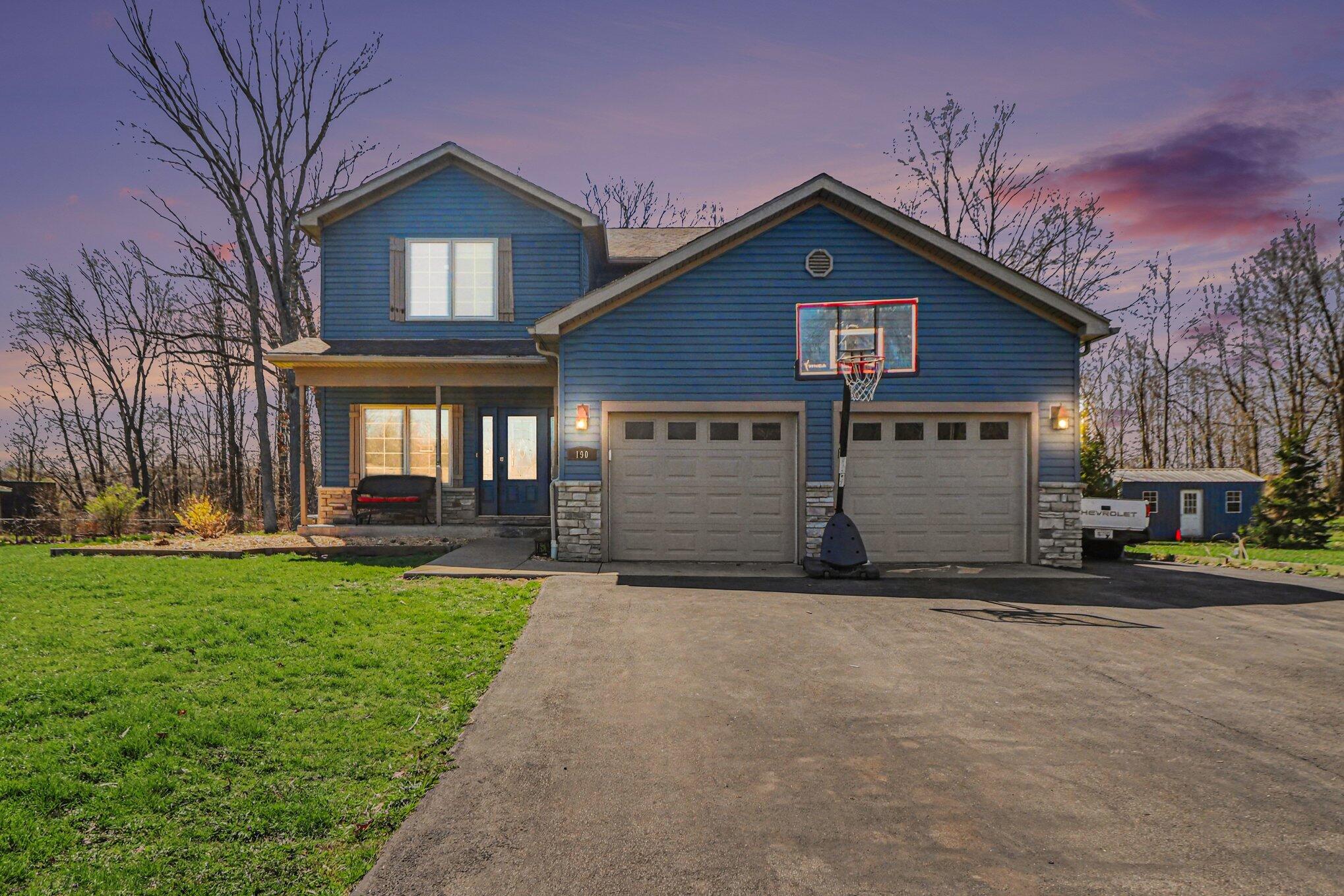a view of a house with a yard