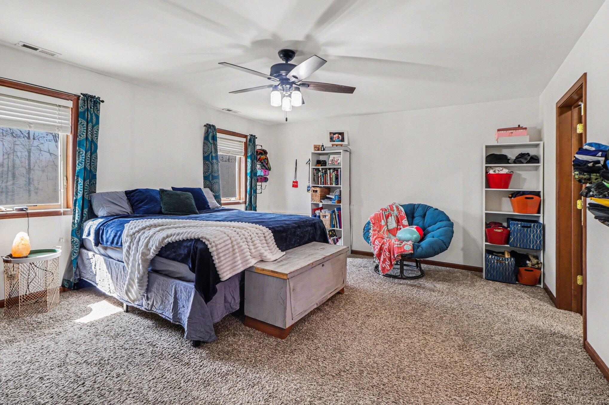 190 East Mekeland Road Chesterton, IN 46304 - Photo 12 of 29 a bedroom with bed and a chandelier
