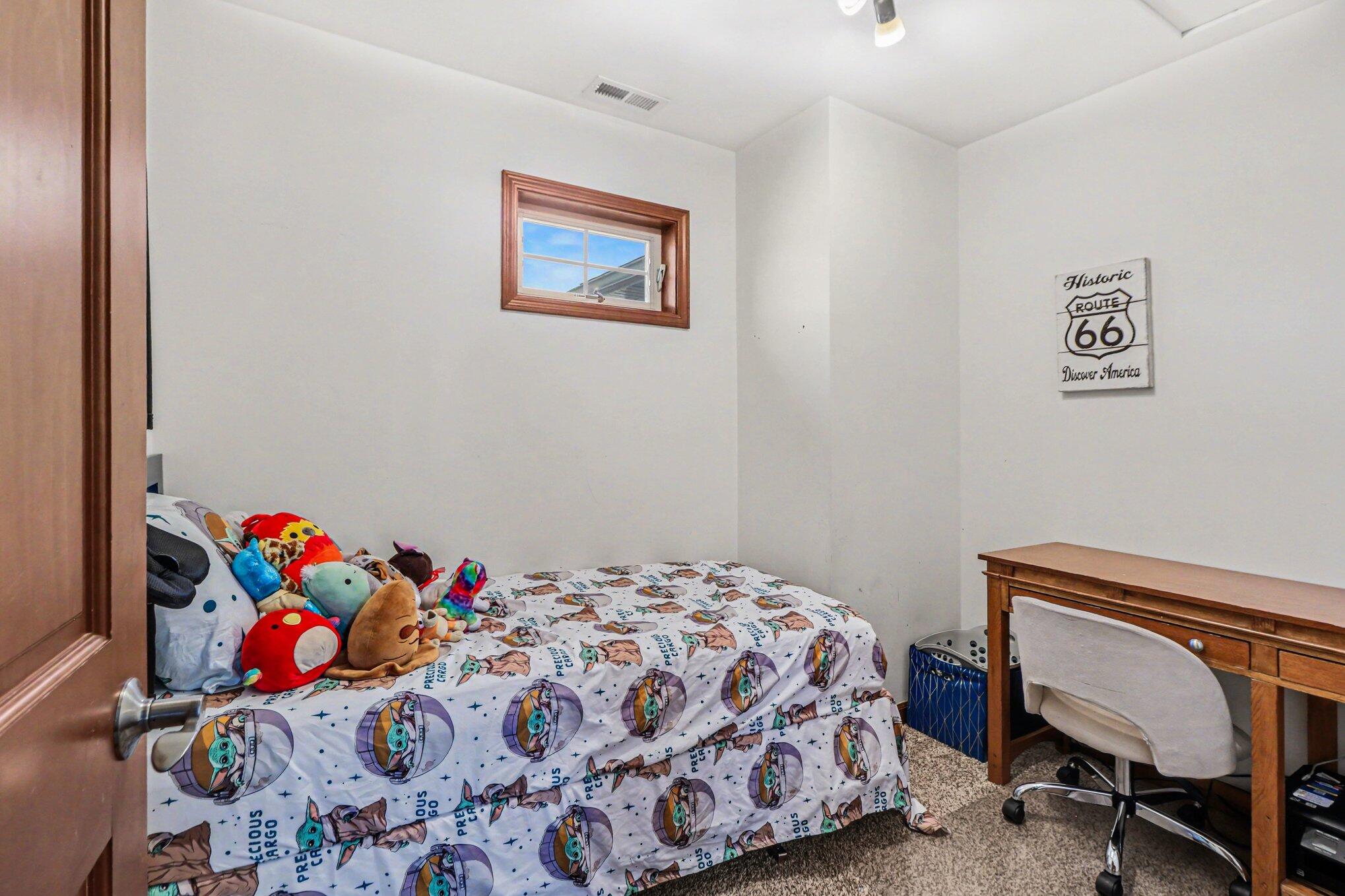 190 East Mekeland Road Chesterton, IN 46304 - Photo 15 of 29 a bedroom with a bed and a chair