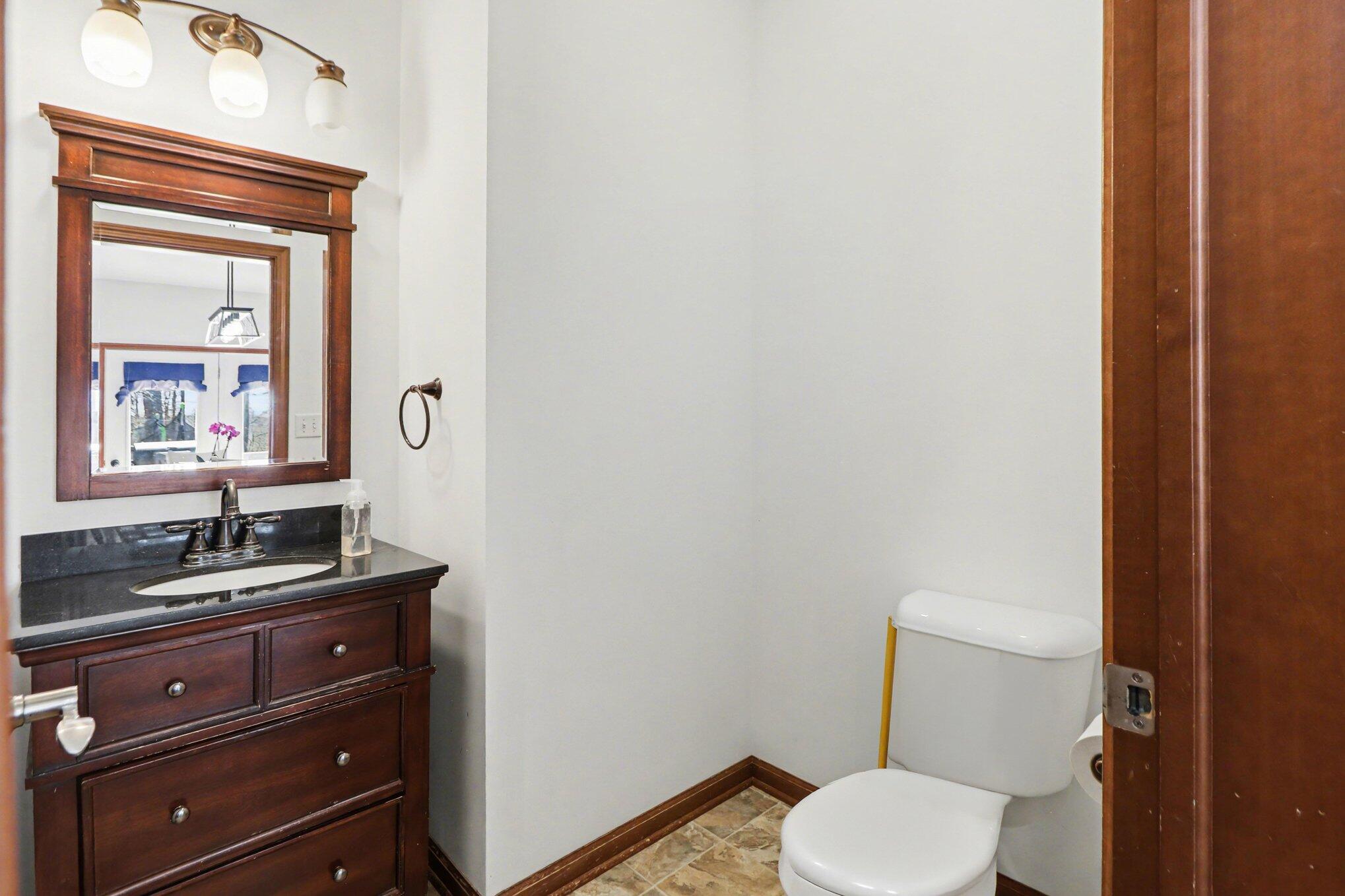 190 East Mekeland Road Chesterton, IN 46304 - Photo 6 of 29 a bathroom with a toilet sink and mirror