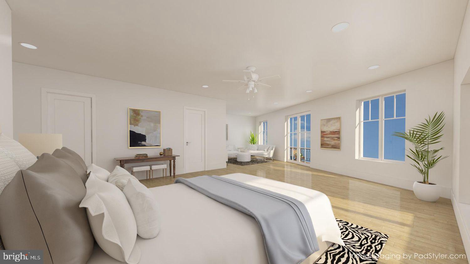 8100 Germantown Avenue, Unit B Philadelphia, PA 19118 - Photo 12 of 18 a spacious bedroom with a bed and a couch