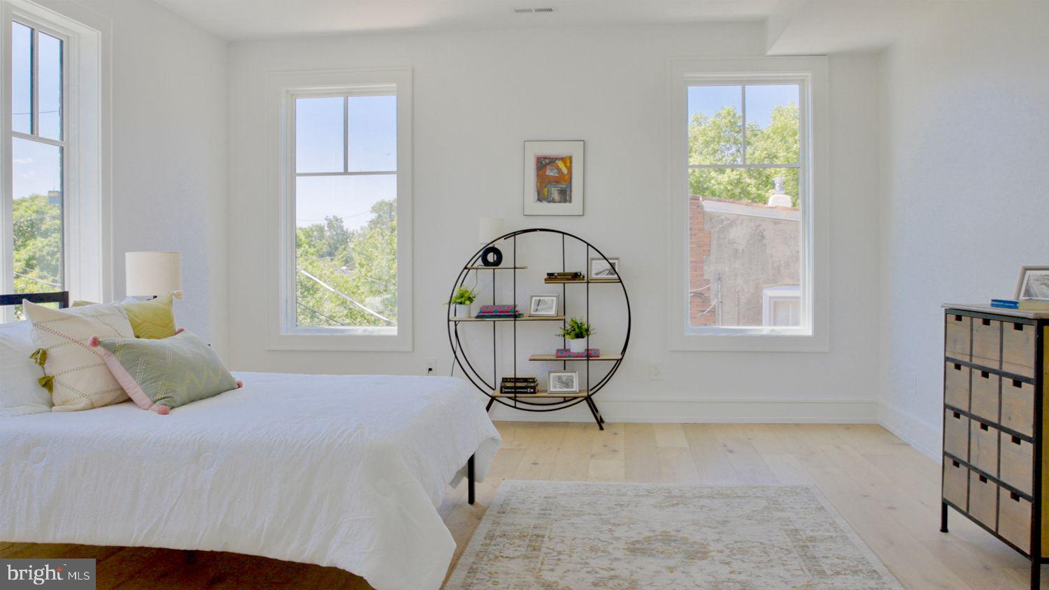 8100 Germantown Avenue, Unit B Philadelphia, PA 19118 - Photo 14 of 18 a view of a bedroom with a bed and a window