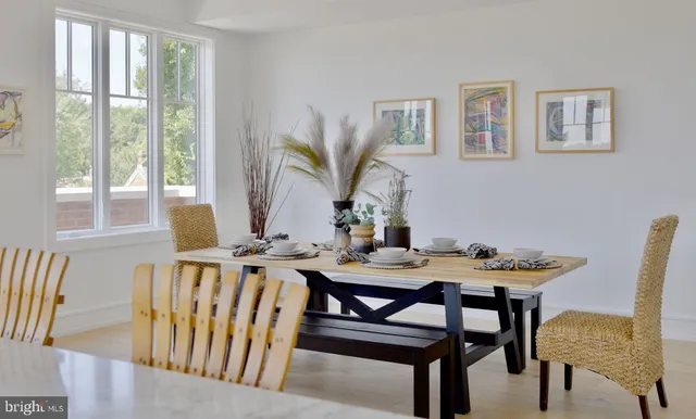 a view of a dining room with furniture and window