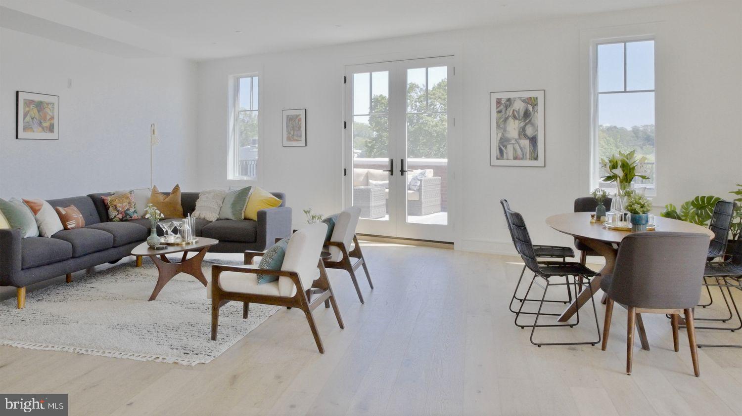 8100 Germantown Avenue, Unit B Philadelphia, PA 19118 - Photo 8 of 18 a living room with furniture and a potted plant