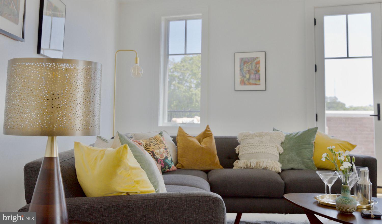 8100 Germantown Avenue, Unit B Philadelphia, PA 19118 - Photo 9 of 18 a living room with furniture and a window