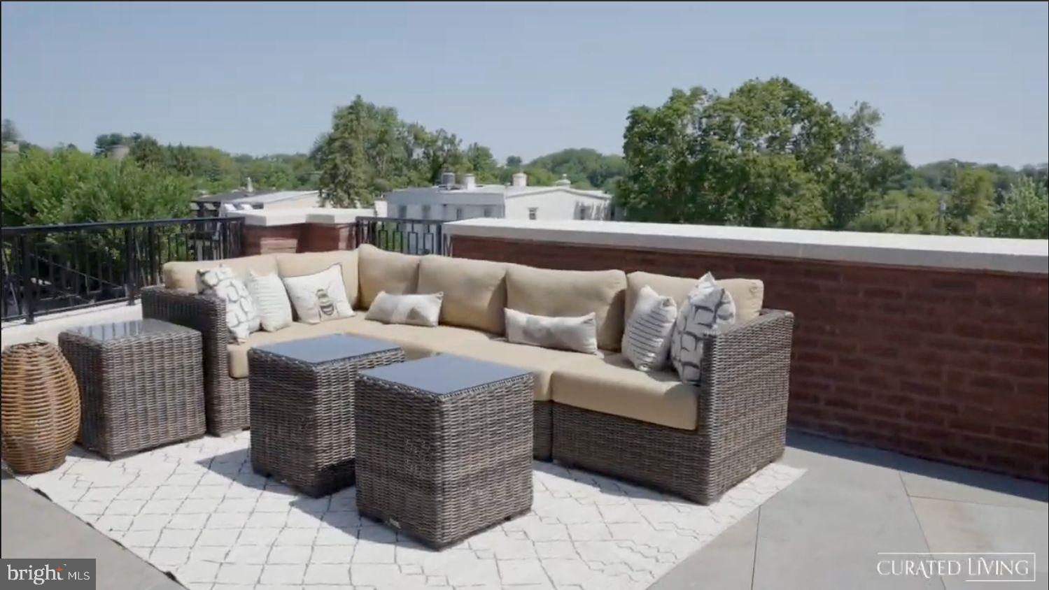 8100 Germantown Avenue, Unit B Philadelphia, PA 19118 - Photo 10 of 18 a roof deck with couches and potted plants