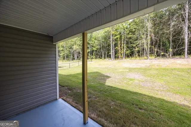 a view of a yard from a balcony