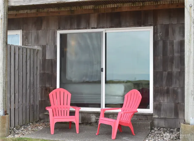 a chair and table in front of a door