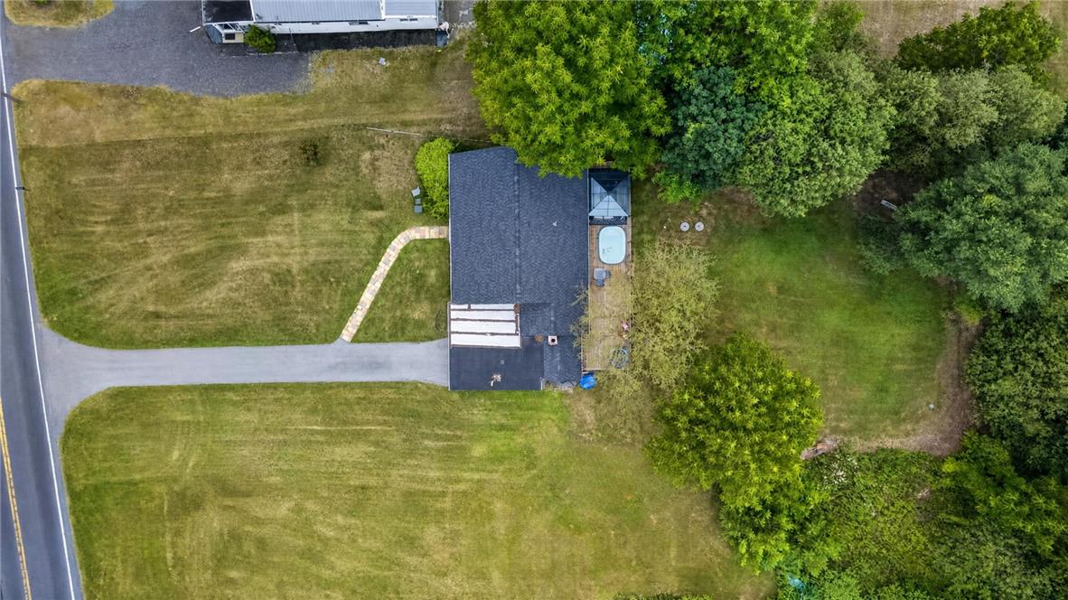 3123 Orefield Road Allentown, PA 18104 - Photo 8 of 39 An aerial perspective reveals a cozy dwelling nestled amidst abundant greenery and a winding driveway.