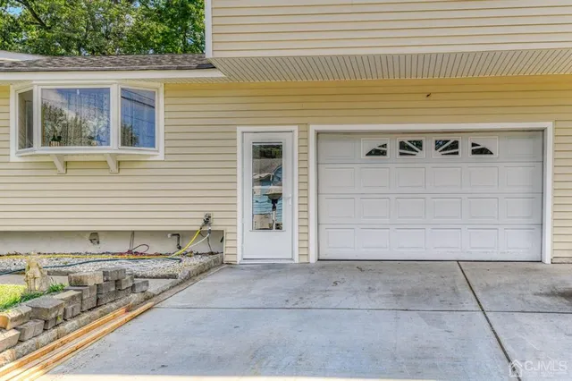 a front view of a house with garage