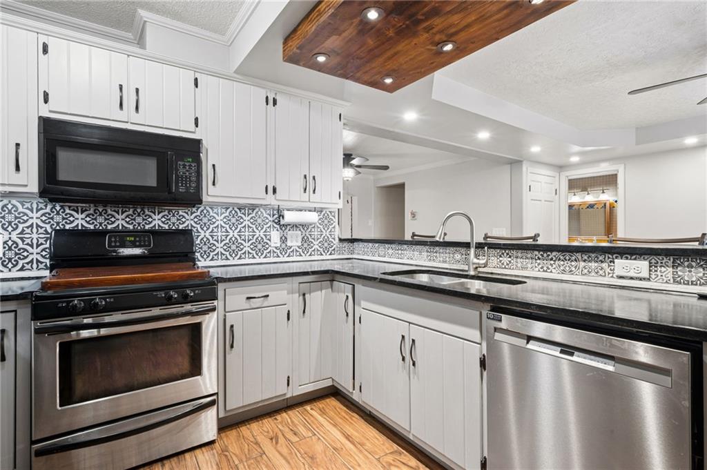 255 Poplar Street Monroeville, PA 15146 - Photo 14 of 44 Stylish patterned tile backsplash that adds character and visual interest to this contemporary kitchen.