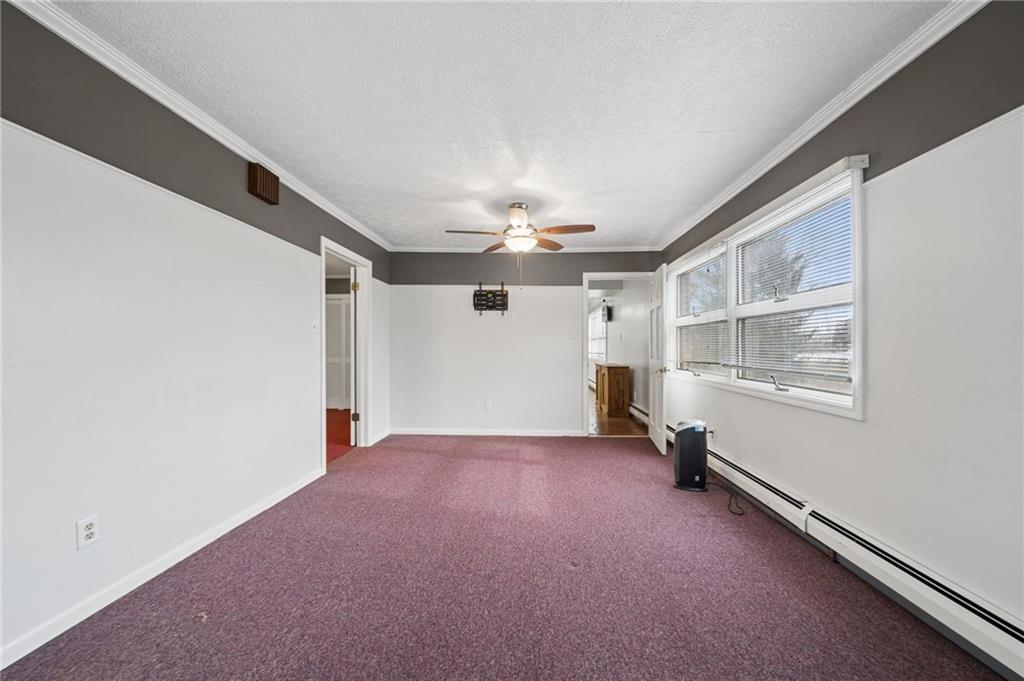 255 Poplar Street Monroeville, PA 15146 - Photo 18 of 50 a view of a livingroom with a ceiling fan and window