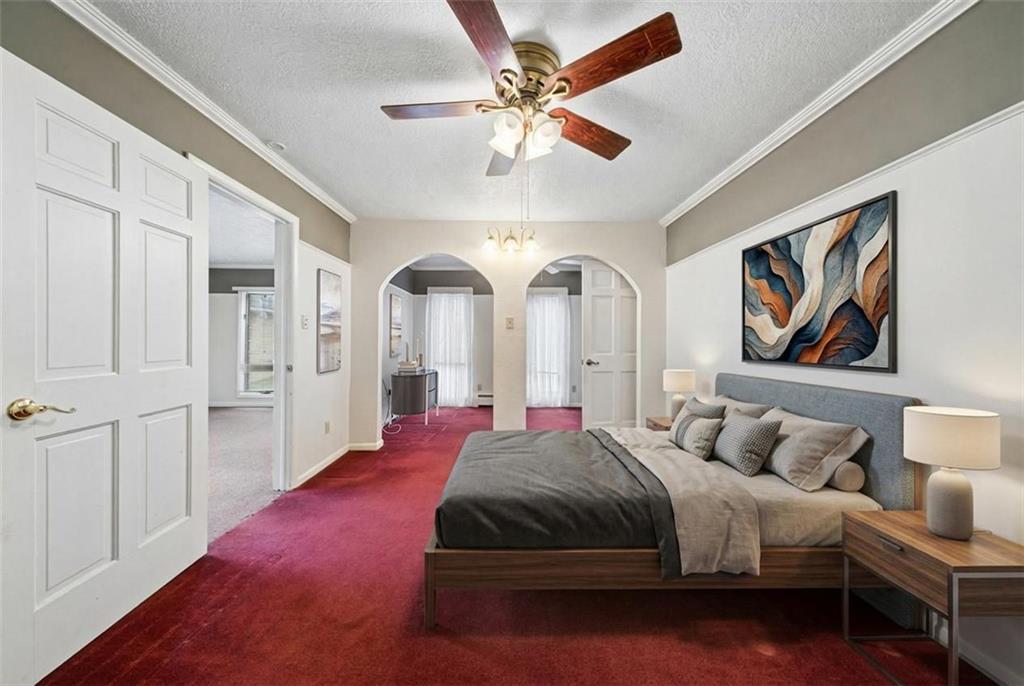 255 Poplar Street Monroeville, PA 15146 - Photo 20 of 50 a spacious bedroom with a bed and a chandelier