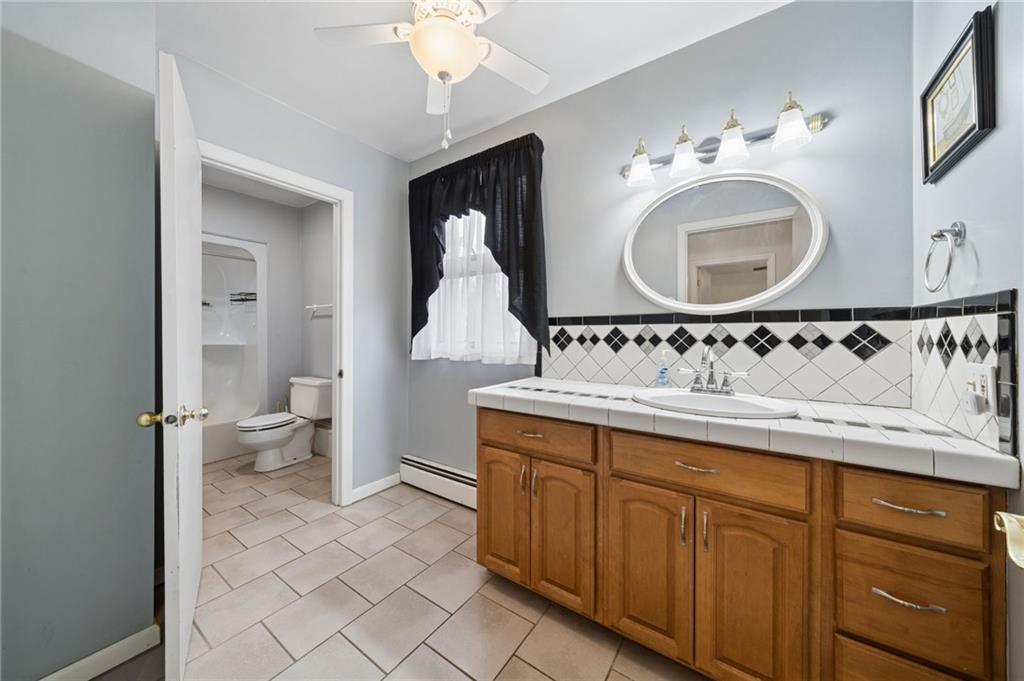 255 Poplar Street Monroeville, PA 15146 - Photo 23 of 50 a bathroom with a sink and a mirror