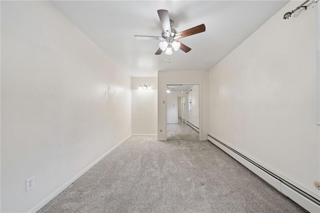 255 Poplar Street Monroeville, PA 15146 - Photo 25 of 50 an empty room with a chandelier fan and closet area