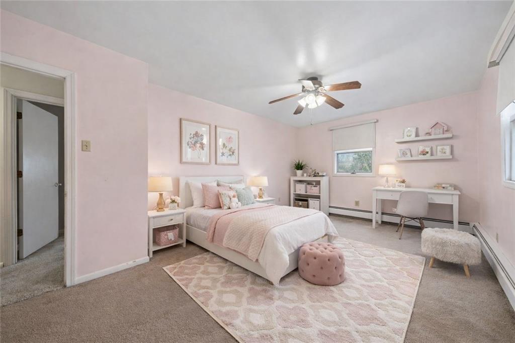 255 Poplar Street Monroeville, PA 15146 - Photo 28 of 50 a bedroom with a bed and a chandelier