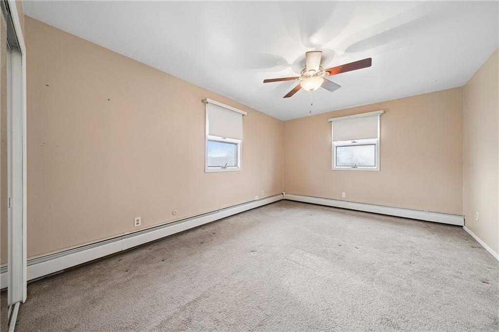 255 Poplar Street Monroeville, PA 15146 - Photo 30 of 50 an empty room with a window and a ceiling fan