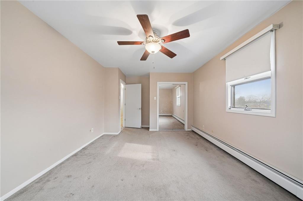 255 Poplar Street Monroeville, PA 15146 - Photo 32 of 50 a view of an empty room with a ceiling fan