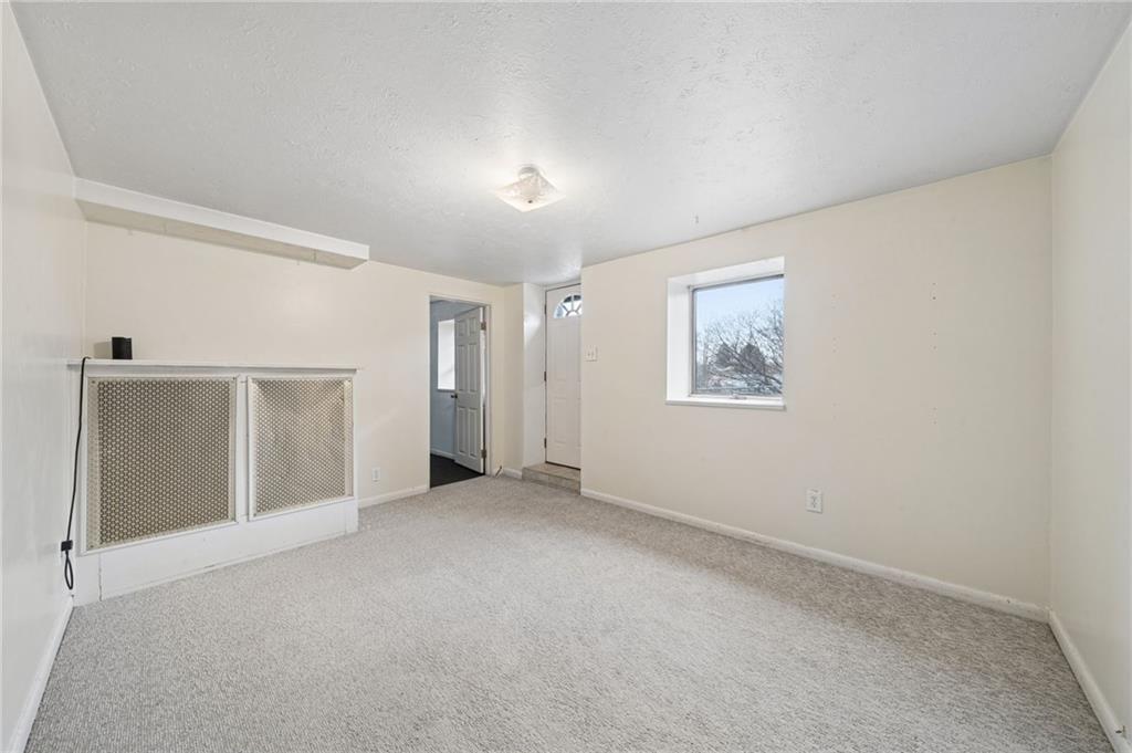255 Poplar Street Monroeville, PA 15146 - Photo 32 of 44 Living room of the lower-level. Perfect for guests, with it's own separate entrance. This space is accessible from the exterior of the home.