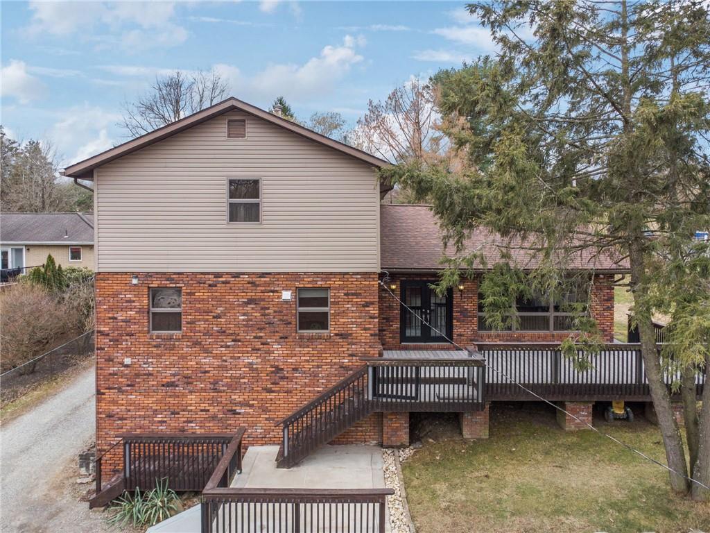 255 Poplar Street Monroeville, PA 15146 - Photo 46 of 50 a view of a house with wooden deck and furniture