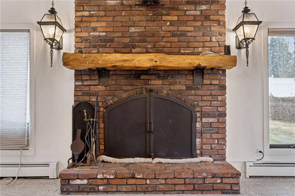 255 Poplar Street Monroeville, PA 15146 - Photo 10 of 50 a fireplace with a wooden floor
