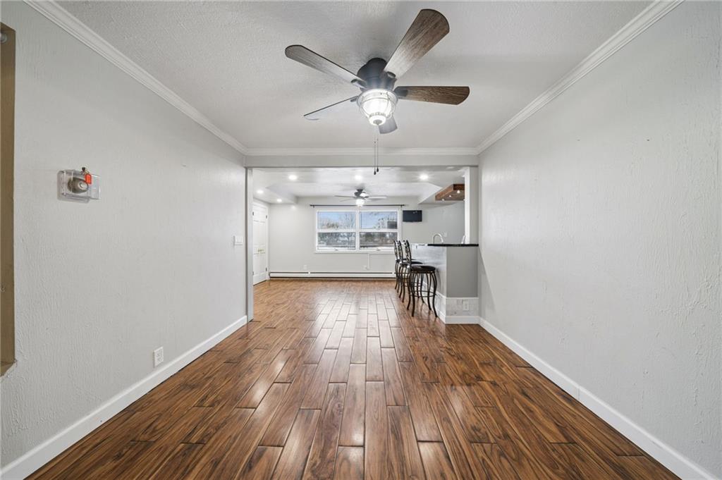 255 Poplar Street Monroeville, PA 15146 - Photo 10 of 44 Wood-look ceramic tile provide a warm and inviting feel to the dining area.