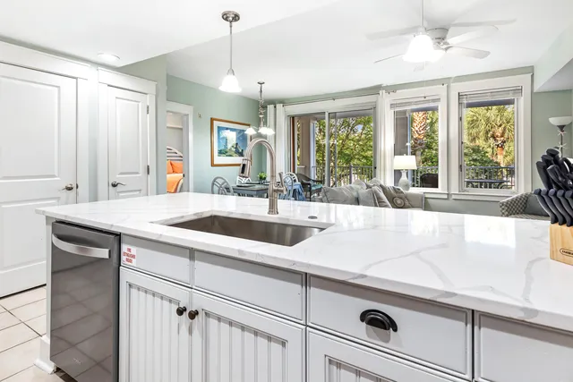 a kitchen with a sink and large window