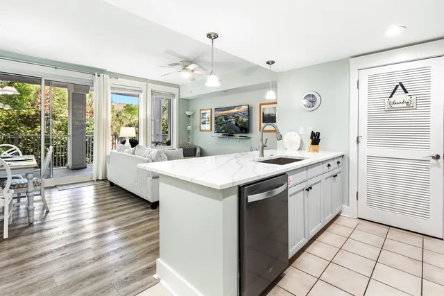 a view of living room with granite countertop furniture and fireplace