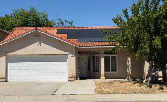 798 Hazelhurst Way Coalinga, CA 93210 - Photo 1 of 3 a backyard of a house with a basket ball court and palm trees