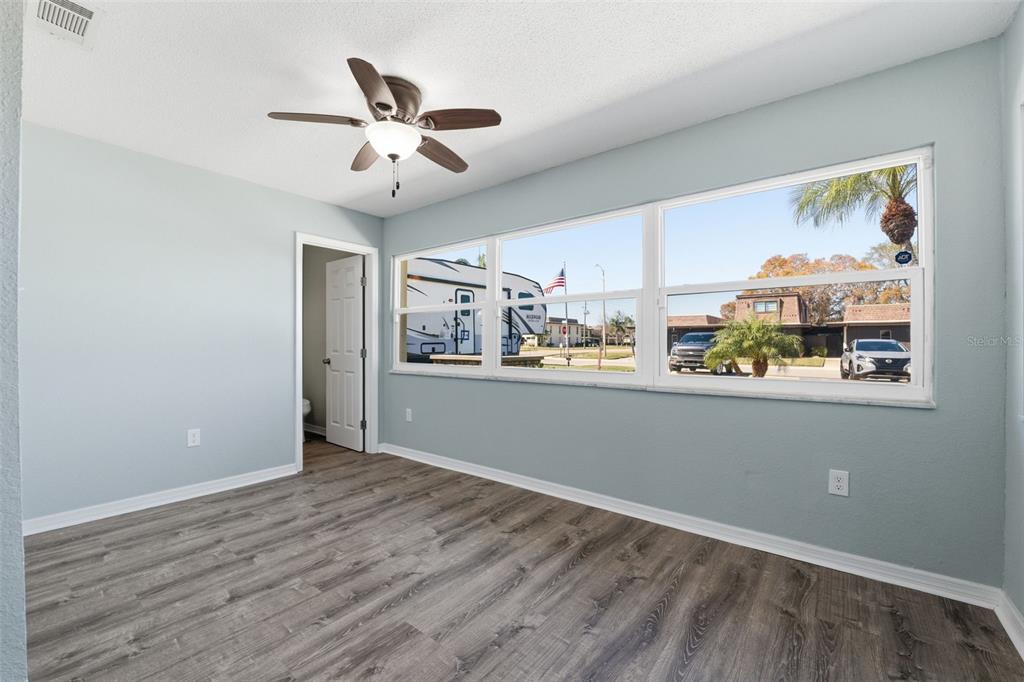 5153 Turquoise Lane, Unit 102 New Port Richey, FL 34652 - Photo 17 of 29 a view of cabinets and wooden floor