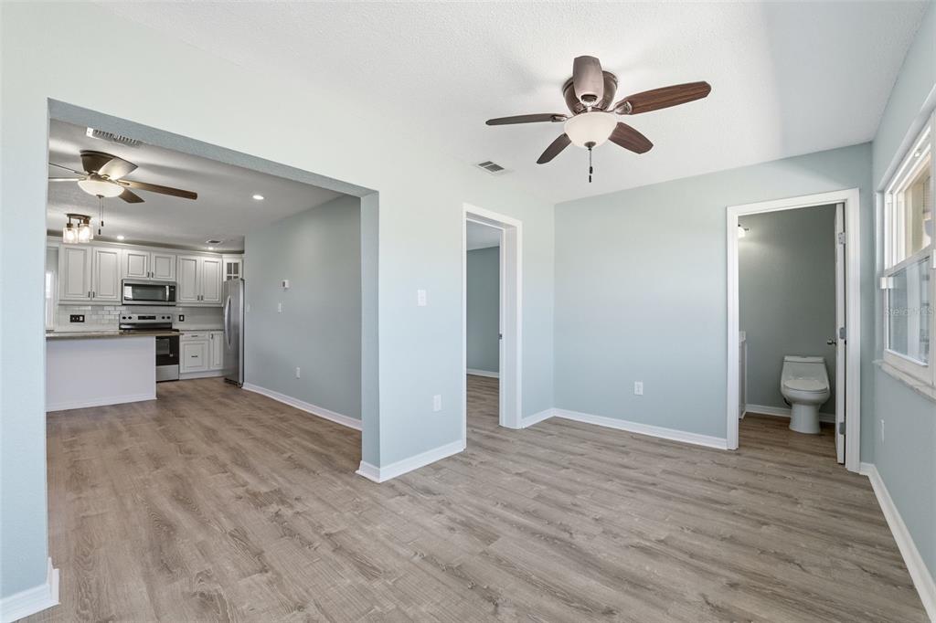 5153 Turquoise Lane, Unit 102 New Port Richey, FL 34652 - Photo 19 of 29 a view of empty room with wooden floor and window