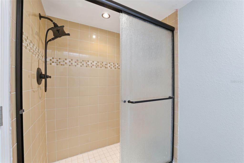 5153 Turquoise Lane, Unit 102 New Port Richey, FL 34652 - Photo 27 of 29 a bathroom with a shower