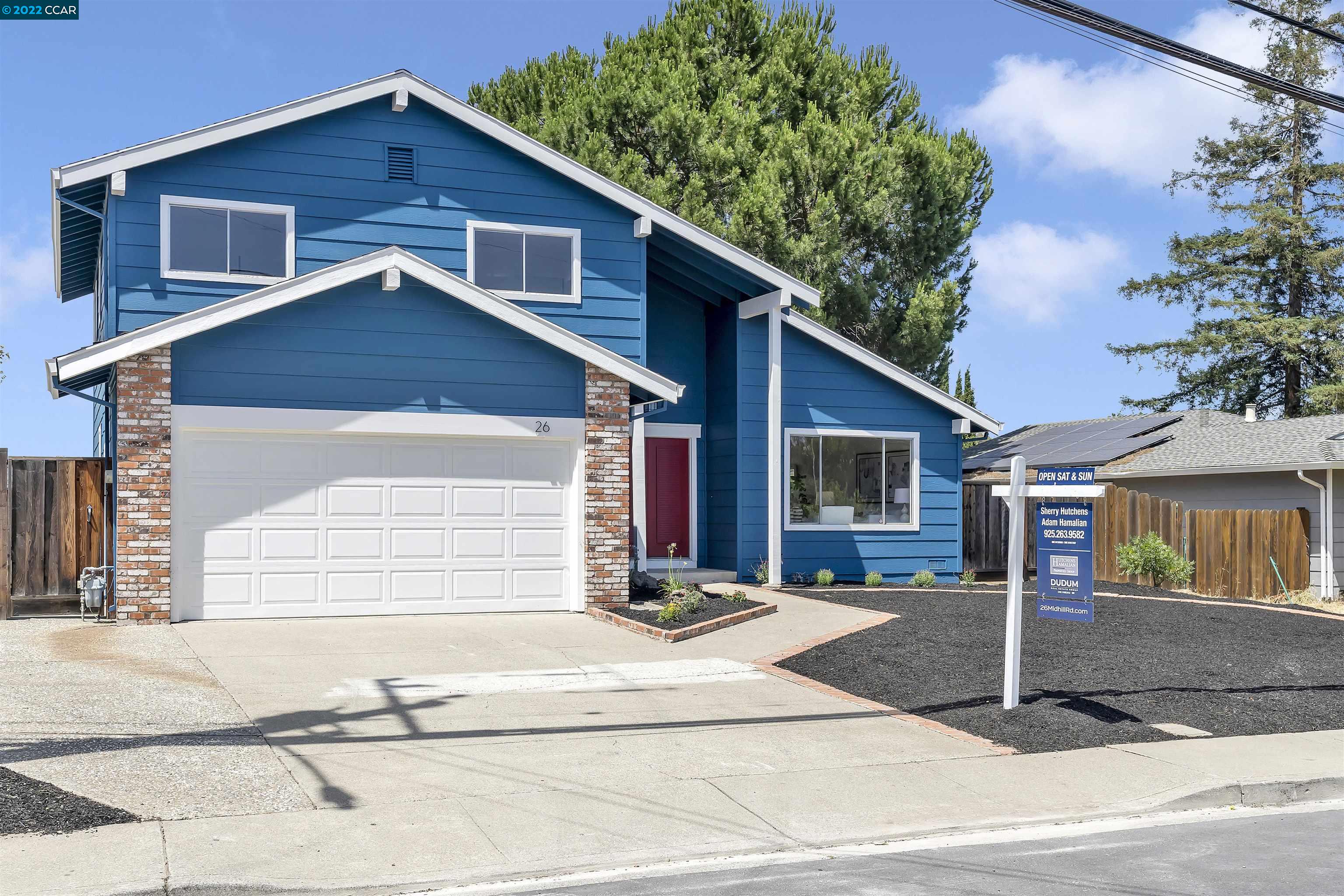26 Midhill Road Martinez, CA 94553 - Photo 1 of 1 a front view of a house with a garage