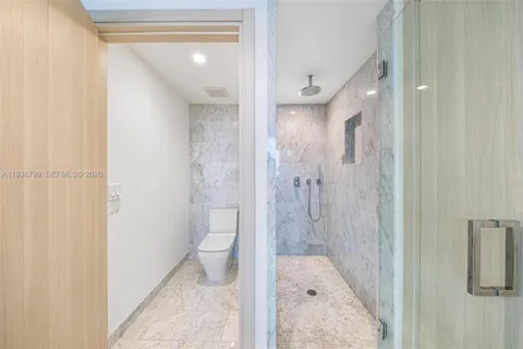 a view of hallway with wooden floor