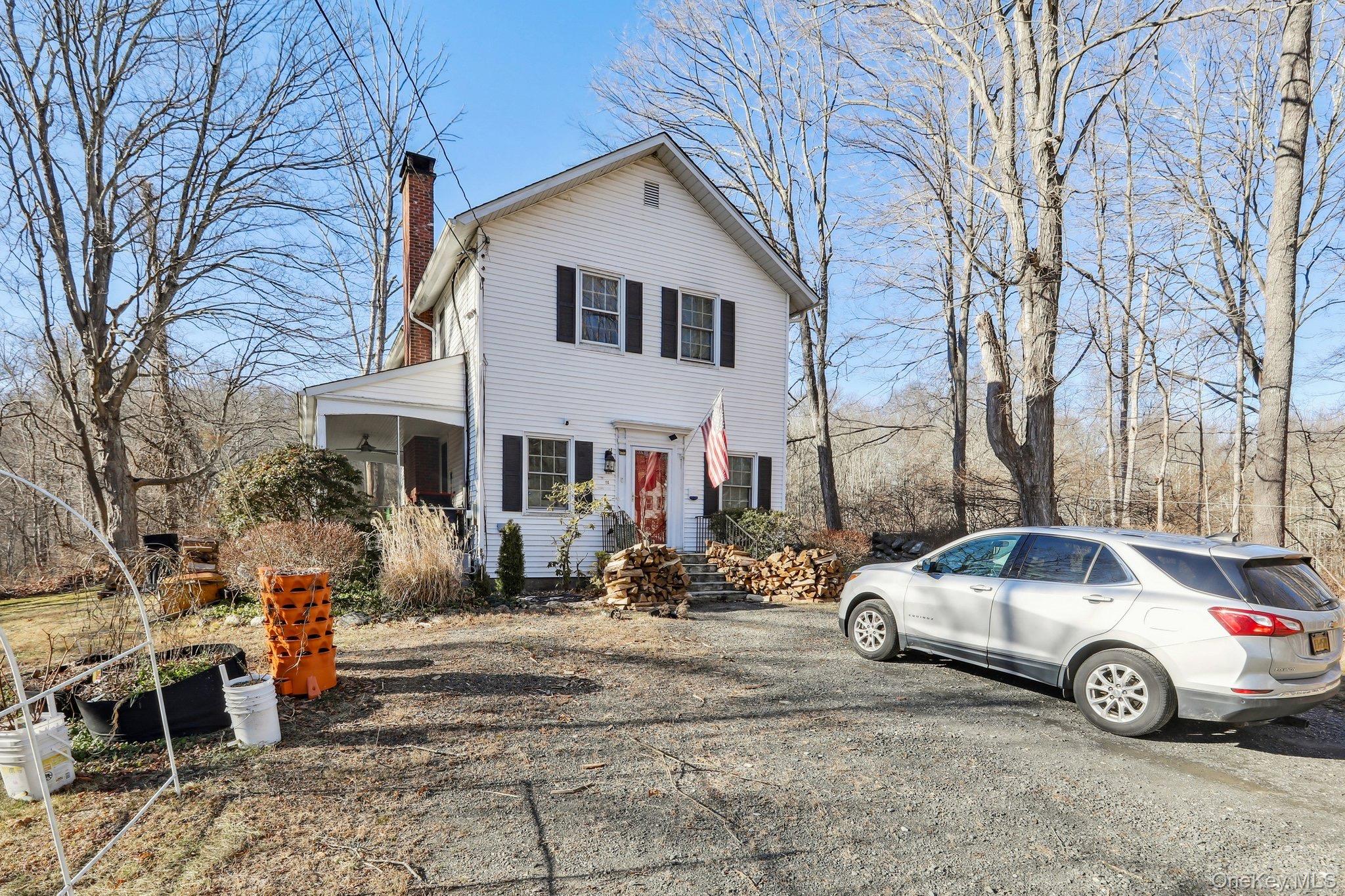 114 Spring Street South Salem, NY 10590 - Photo 13 of 13 a car parked in front of white house