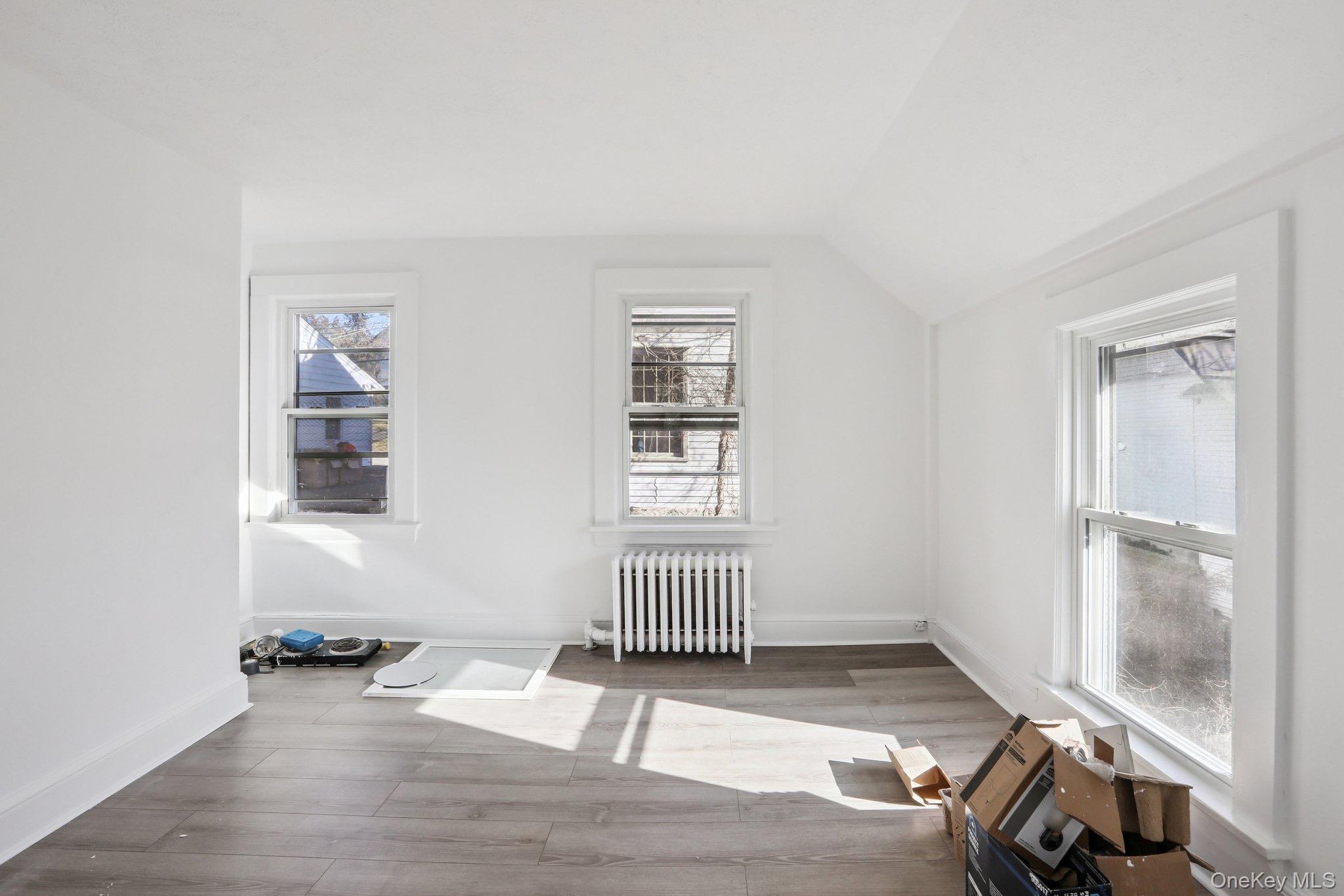 114 Spring Street South Salem, NY 10590 - Photo 5 of 13 an empty room with wooden floor and windows