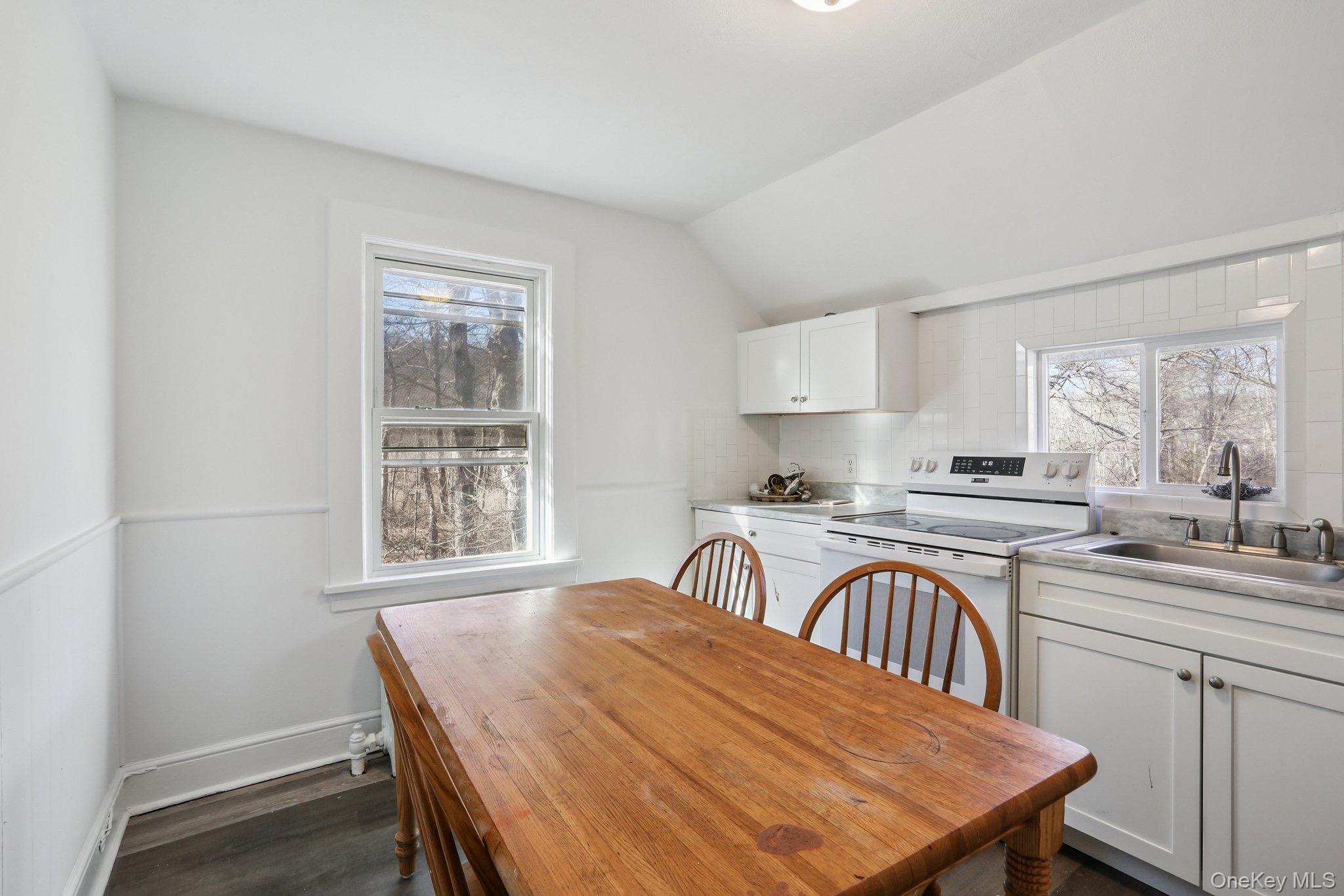 114 Spring Street South Salem, NY 10590 - Photo 9 of 13 a view of a kitchen with a table and chairs