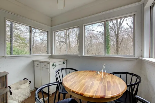 a view of a dining room with furniture window and outside view