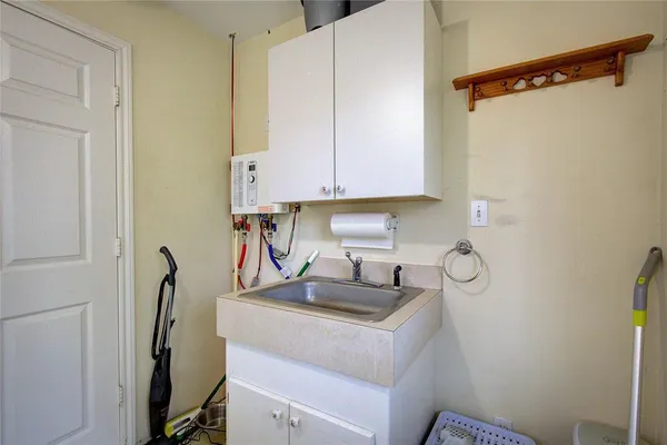 a kitchen with a sink and cabinets