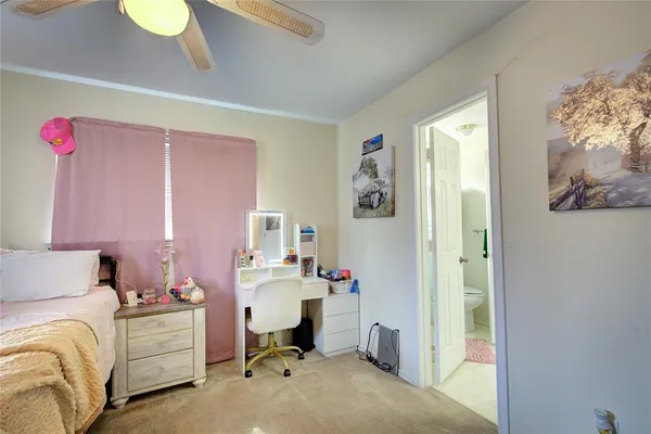 a room with a bed and a chandelier