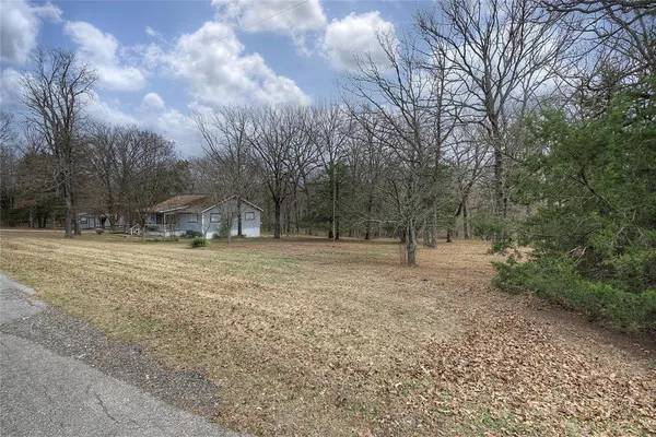 a backyard of a house with trees