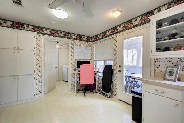 a bedroom with furniture and a dresser