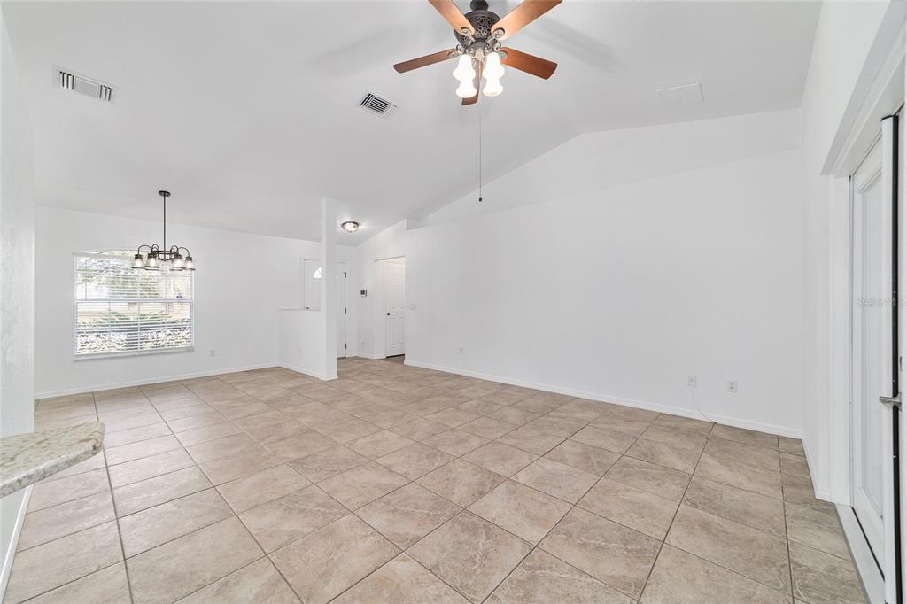 13688 Southwest 113th Lane Dunnellon, FL 34432 - Photo 12 of 70 a view of an empty room and window with a ceiling fan