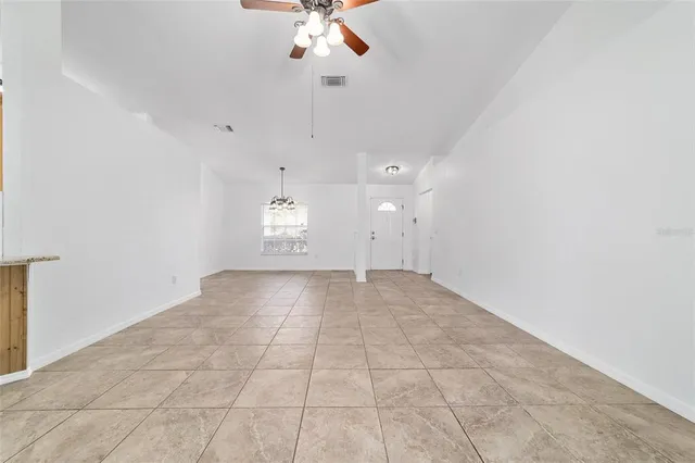 a view of a chandelier in big room and chandelier