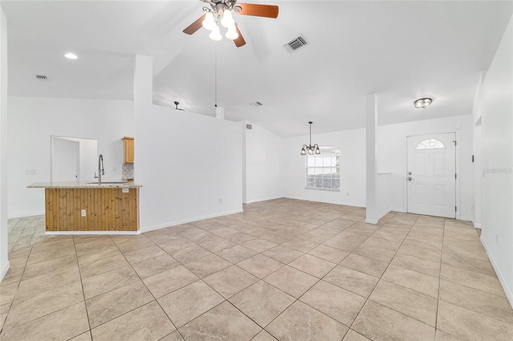 13688 Southwest 113th Lane Dunnellon, FL 34432 - Photo 14 of 70 a view of a kitchen with a sink and a refrigerator