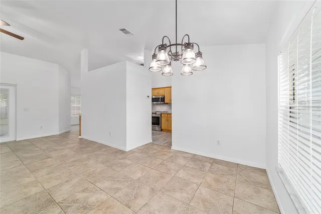 a kitchen with stainless steel appliances granite countertop a granite counter tops and a stove
