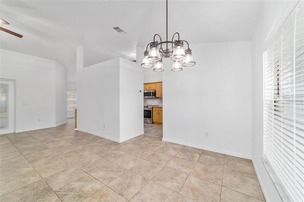 13688 Southwest 113th Lane Dunnellon, FL 34432 - Photo 17 of 70 a view of a chandelier in big room and chandelier