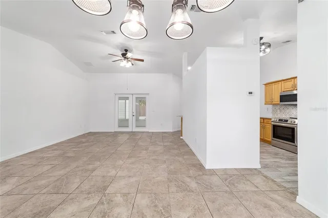 a view of empty room with windows